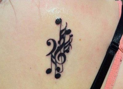 Small Musical Notes Tattoo On Back